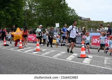 Children And Parents Running At A Children's Run Called 