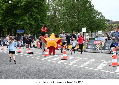 Children And Parents Running At A Children's Run Called 