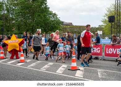 Children And Parents Running At A Children's Run Called 