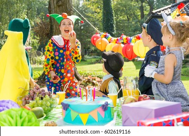 Children And Party Entertainer Wearing Funny Costumes During Birthday