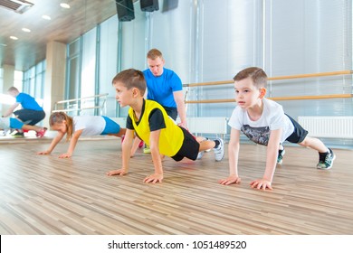 Children At Physical Education Lesson In School Gym Gymnast Kid