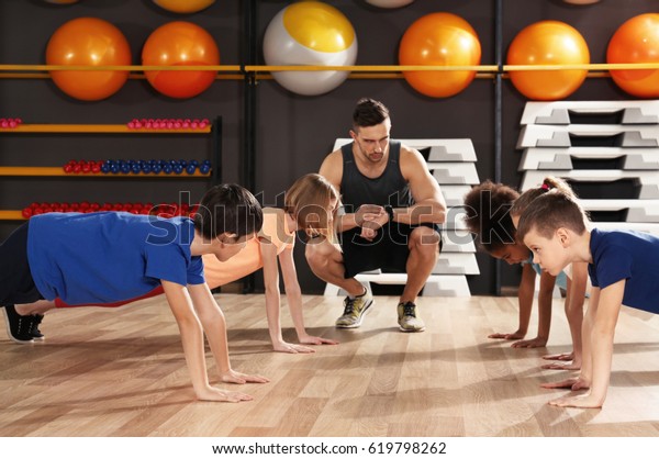 Children at\
physical education lesson in school\
gym