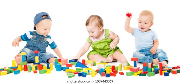 Children Play Blocks Toys, Kids Group Playing Colorful Building Bricks, Babies Isolated Over White Background