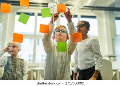 Children play business team at brainstorming in elementary school - Powered by Shutterstock