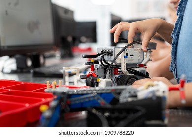 Children Play With A Robot In A Robotics Class