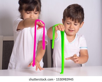 Children Play With Slime. Kid Squeeze And Stretching Toy Slime.