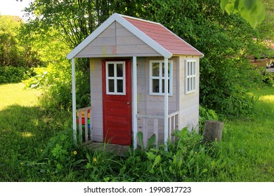 Children playground of natural wood in the countryside, in summer. ecological wooden playhouse and swings for children
 - Powered by Shutterstock