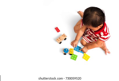 Children Playing A Brainstorming Toy On White Background,Toys For Children Growing Up,colourfuls Toys,Children Sitting On The Floor Are Playing Toys With Isolate Photograph