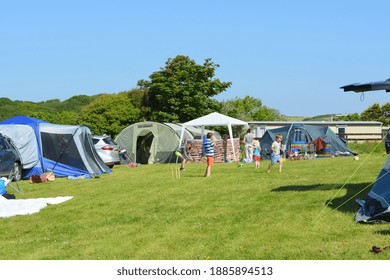 Children Playing At The Camping Site In May, Pembrokeshire, Wales, UK.