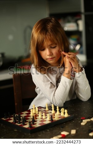 Similar – Image, Stock Photo lifestyle shot of smart kid girl playing checkers at home