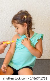 Children Playing Doctor. Doctor Injecting Vaccination Flu Shot In Arm Little Child Girl, Healthy And Medical Concept.