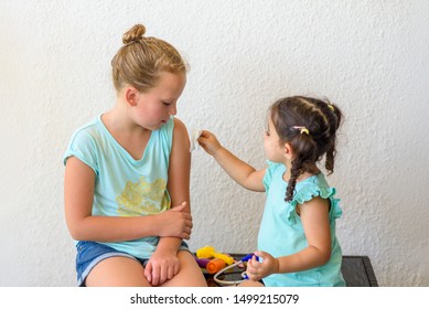 Children Playing Doctor. Doctor Injecting Vaccination Flu Shot In Arm Little Child Girl, Healthy And Medical Concept.