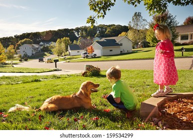 Children Playing With Dog Outside