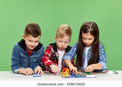 children playing with electronic constructor at studio