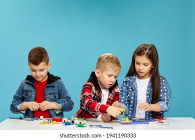 children playing with electronic constructor at studio