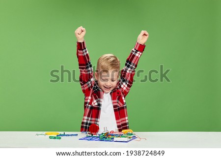 children playing with electronic constructor at studio