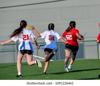 Children Playing A Flag Football Game Outside