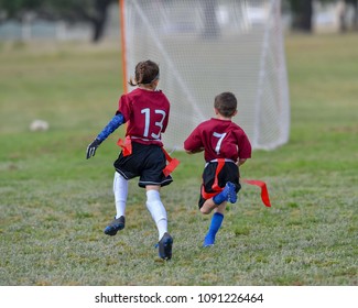 Children Playing A Flag Football Game Outside