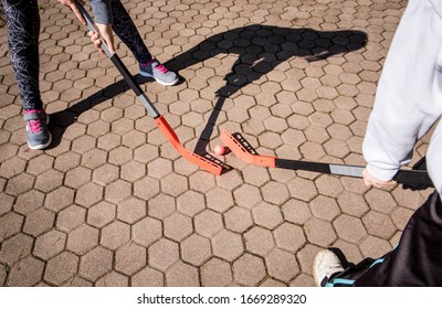 Children Are Playing Hockey On The Street