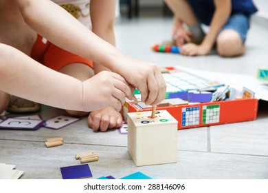 Children Playing With Homemade, Do-it-yourself Educational Toys. Learning Through Experience Concept. 