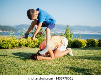 children playing leapfrog in the grass