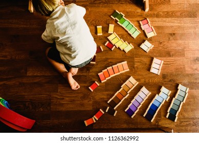 Children Playing And Learning With Montessori Color Tablets