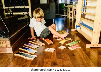 Children Playing And Learning With Montessori Color Tablets