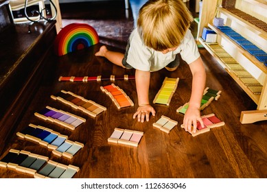 Children Playing And Learning With Montessori Color Tablets