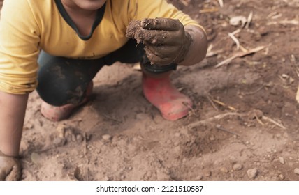 Children Playing And Muddy Hands.