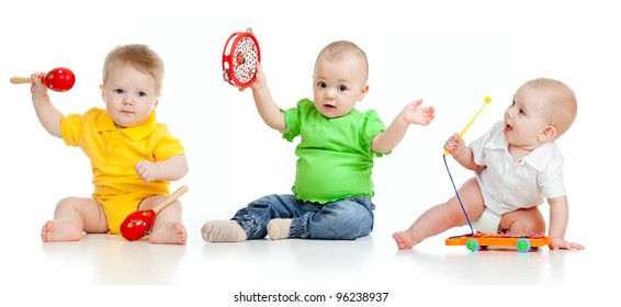 Children Playing With Musical Toys. Isolated On White Background