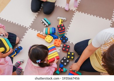 Children playing at nursery school - Shutterstock ID 1935667456