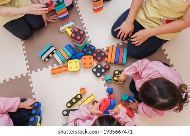 Children playing at nursery school - Shutterstock ID 1935667471