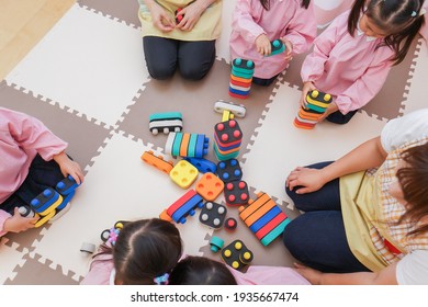 Children playing at nursery school - Shutterstock ID 1935667474