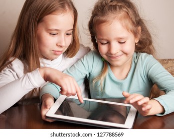 Children Playing On Tablet. Kids Looking At Computer