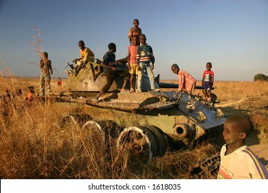 Children Playing On Tank In Minefield In Kuito Angola