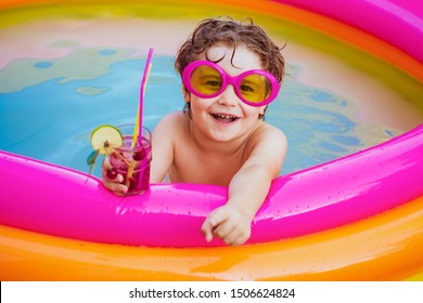 Children Playing In Pool. Child Water Toys. Stylish Sunglasses. Beach Clubs In Ibiza. Beach Party. Child Swimming Pool. Kids Swimming Pool Concept. Child Water Toys