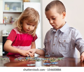 Children, playing puzzles at home