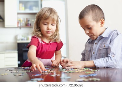 Children, playing puzzles at home
