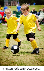 Children Playing Soccer In Organized Youth Game