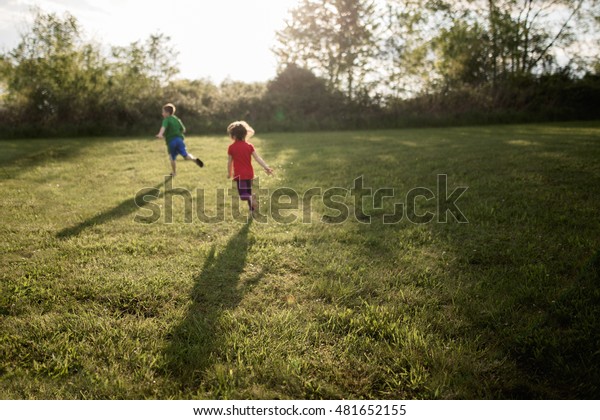 Children Playing Tag Yard Stock Photo Edit Now 481652155