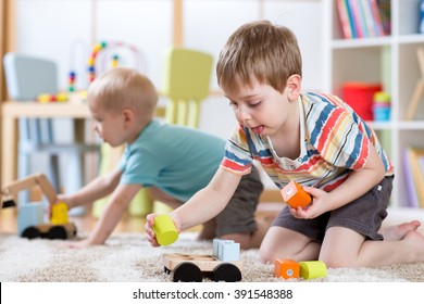 Children Playing With Toys In Kindergarten Or Daycare Or Home