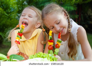 Children Playing With Vegetables