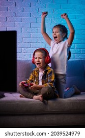 Children Playing Video Game With Game Console