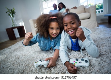 Children Playing Video Games At Home