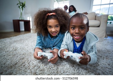 Children Playing Video Games At Home