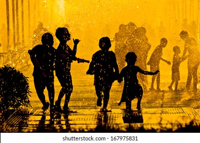 children playing in water - Songkran Festival in Thailand