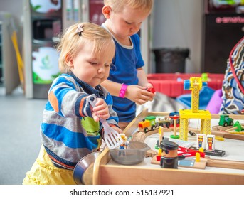 Children Playing With Wooden Train. Toddler Boy And Baby Girl Play With Crane, Train And Cars. Educational Toys For Preschool And Kindergarten Child. ?ute Kids Build Toy Railroad At Home Or Daycare.