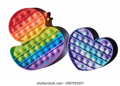 Children Pop It Toys Isolated, Duck And Heart Shaped Fidgets Rainbow Colored. Multicolor Silicone Bubbles Toys For Relax And Antistress. Tik Tok Trend