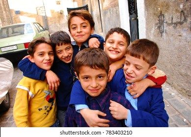 Children Pose For A Photo On The Street In Front Of Their School. Syria Before The War. Aleppo, Syria, Middle East. November 9, 2008.