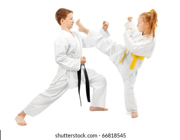 Children practice karate, isolated on white